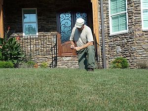 JC Cawley studying turf
